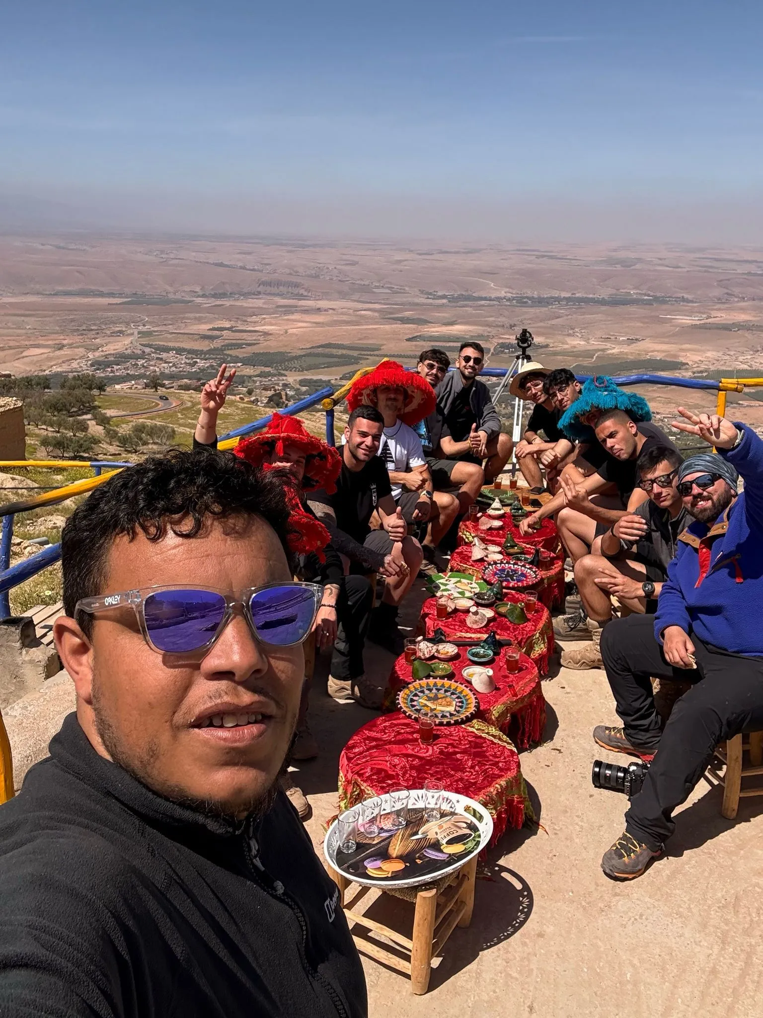 Omar Ait Zine, certified High Atlas mountain guide, with a trekking group in the mountains